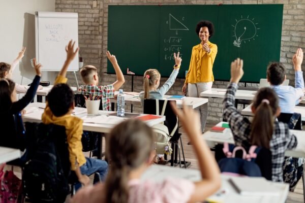 enthusiastic-students-raise-hands-in-classroom-wit-2026-01-07-01-51-20-utc